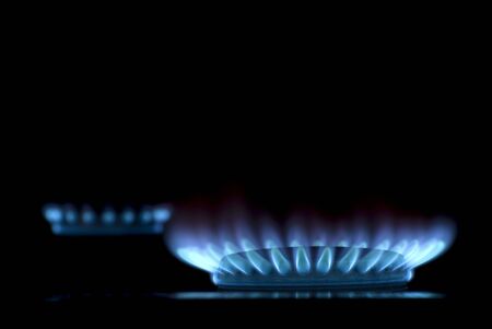 flames of gas stove in the darkの写真素材