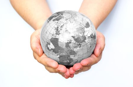 Hands holdings a globe on a whitenessの写真素材