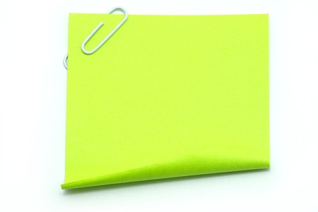 Blank note paper and red paper-clip isolated  on whiteの写真素材