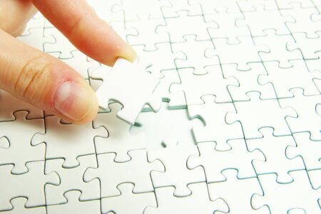 hands holding a puzzle piece . business conceptsの写真素材
