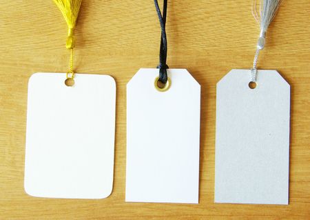 Blank tag isolated on a wooden backgroundの写真素材