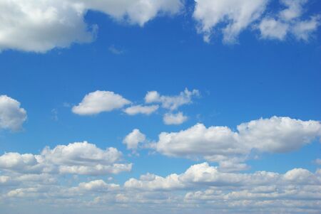 Blue sky background with a tiny clouds    の写真素材