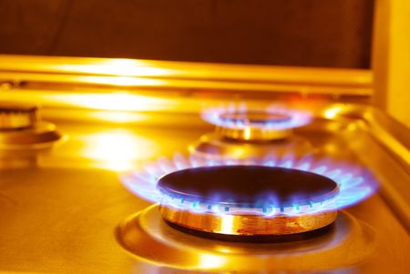 flames of gas stove in the darkの写真素材