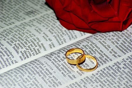Wedding ring over a Bibleの写真素材