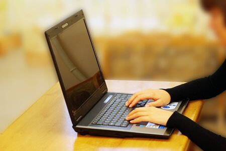 Young woman working on laptopの写真素材