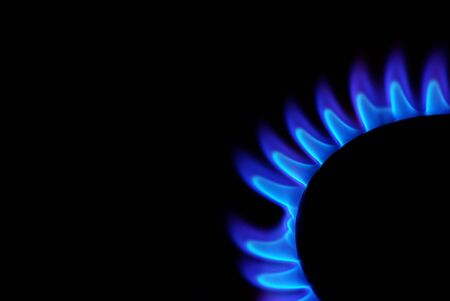 flames of gas stove in the dark       の写真素材