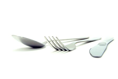 Fork, spoon and knife isolated on white backgroundの写真素材