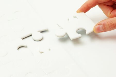 hands holding a puzzle piece . business conceptsの写真素材