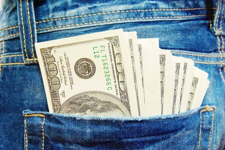 dollars in a pocket of jeans