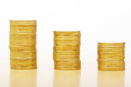 towers of coins isolated on a whitenessの写真素材