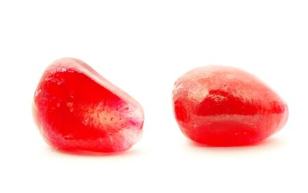 Some pomegranate berries isolated on the white backgroundの写真素材