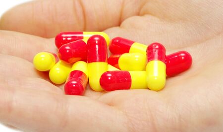 pills capsules of antibiotic in hand 