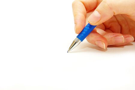Hand and pen on the white backgroundの写真素材