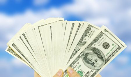 Hand with money isolated on white background