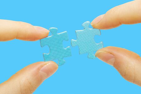  puzzle in hand isolated on blue background