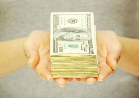 Hand with money isolated on white background