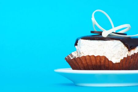 fresh cake isolated on a blue backgroundの写真素材