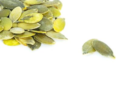 fresh pumpkin seeds isolated on a whiteの写真素材