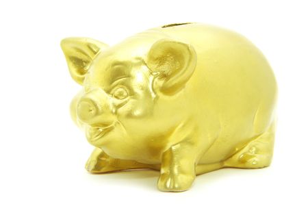 Golden piggy bank isolated on whiteの写真素材