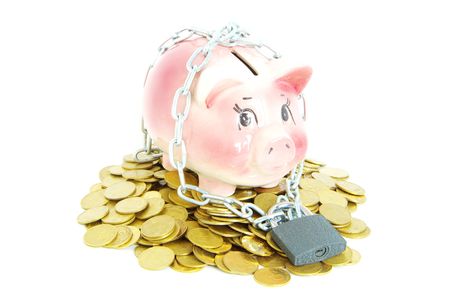 A piggy bank with a chain and padlockの写真素材