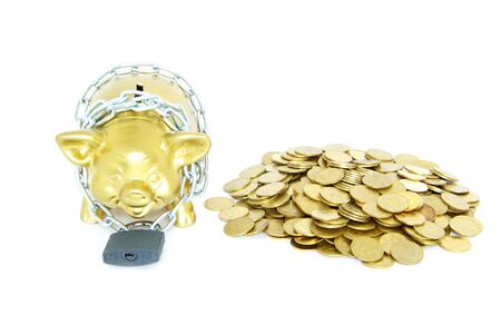 A piggy bank with a chain and padlockの写真素材