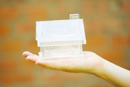 The house in human handの写真素材