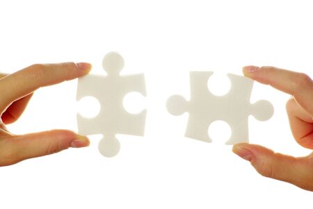  puzzle in hands isolated on white backgroundの写真素材