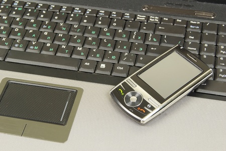 mobile isolated on a laptopの写真素材