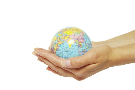 Hand holdings a globe on a whiteの写真素材