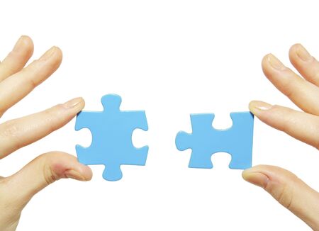  puzzle in hands isolated on white backgroundの写真素材