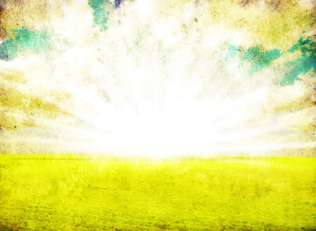 grunge image of green field and blue skyの写真素材