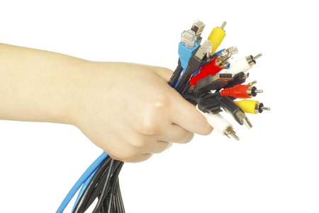 Computer cables in hand isolated on white backgroundの写真素材
