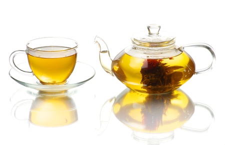 Tea being poured into glass tea cupの写真素材
