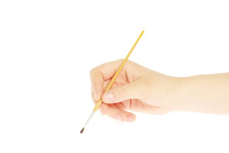 Isolated photo of a brush in a handの写真素材