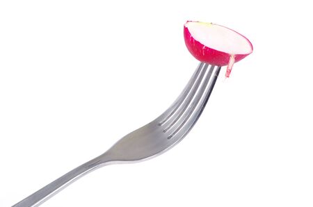 Radish on a fork isolated on whiteの写真素材