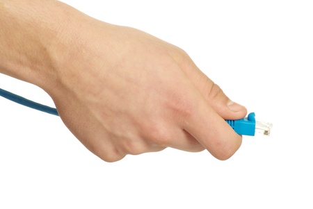 Computer cables in hand isolated on white backgroundの写真素材