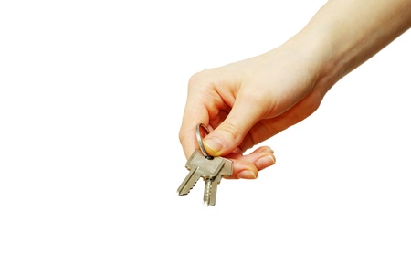 key in hand isolated on whiteの写真素材