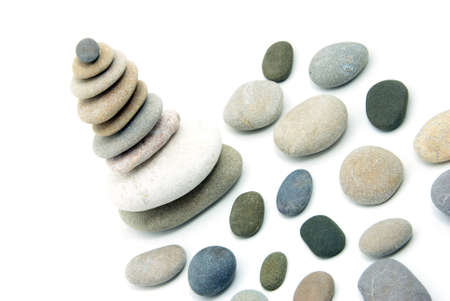 Stack of balanced stones on a white background
