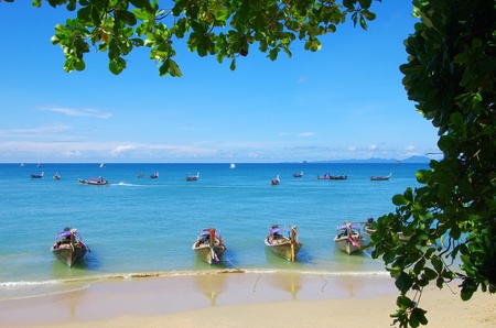Tropical beach, longtail boats, Andaman Sea, Thailandの写真素材