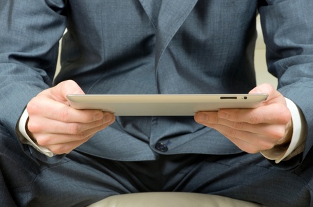 hands holding the tablet computerの写真素材