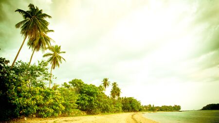 Retro beach and blue sky for backgroundの写真素材