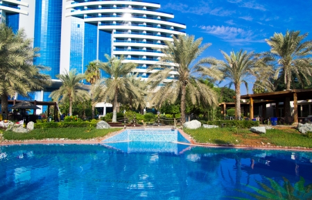  swimming pool with coconut tree and umbrellaのeditorial素材