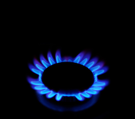flames of gas stove in the dark の写真素材