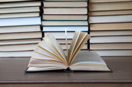 books on wooden deck tabletopの写真素材