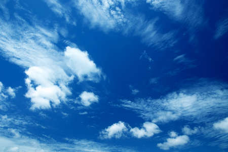 blue sky background with tiny clouds