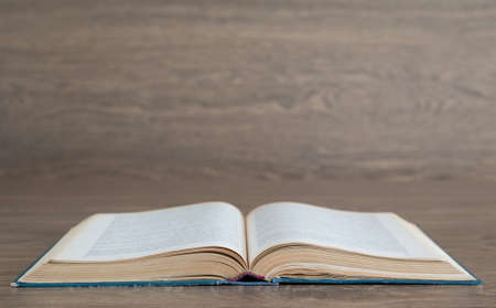 Open book on wood backgroundの写真素材