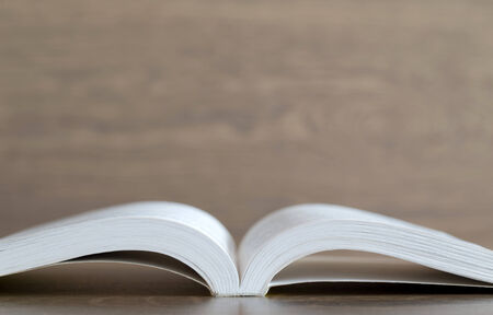Open book on wood backgroundの写真素材