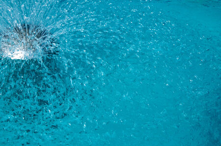 Blue pool water with sun reflectionsの写真素材