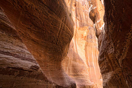 The Siq, the narrow slot-canyon that serves as the entrance passage to the hidden city of Petra, Jordan,の写真素材