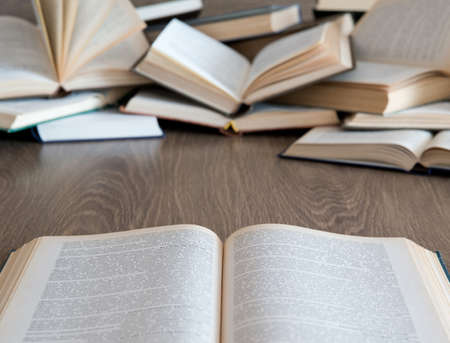 books on wooden deck tabletop